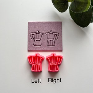 May include: Two pink plastic molds shaped like coffee pots. The molds are on a white surface. The words "Left" and "Right" are written below the molds.