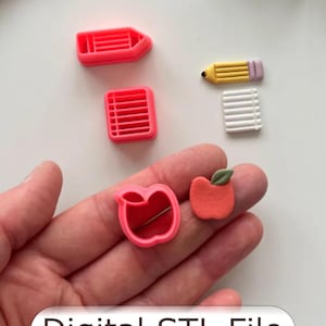 May include: A collection of miniature school-themed objects, including a pink pencil, a notepad, a pencil, and an apple. The apple is red with a green leaf. The text "Digital STL File" is displayed at the bottom.