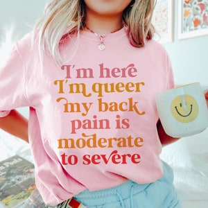 im here im queer my back pain is moderate to severe | queer shirt | scoliosis shirt | chronic illness tshirt | funny queer tee | lgbtq pride
