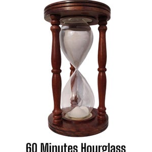 May include: A 60-minute hourglass with a wooden frame. The hourglass is made of clear glass and has a white sand inside. The wooden frame is a dark brown color.