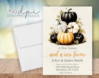 May include: A fall-themed stationery set featuring a watercolor illustration of pumpkins in various colors: black, white, and orange. The text reads "A New Season and a new home" with a new address. Includes a white envelope.