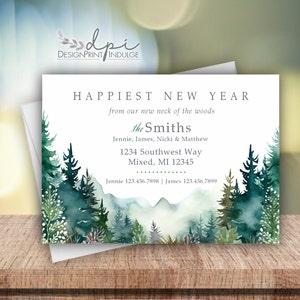 May include: A watercolor illustration of a forest with a white background. The text "Happiest New Year" is at the top of the card. The text "from our new neck of the woods" is below the greeting. The text "the Smiths" is below that. The text "Jennie, James, Nicki & Matthew" is below that. The text "1234 Southwest Way" is below that. The text "Mixed, MI 12345" is below that. The text "Jennie 123.456.7898 | James 123.456.7899" is at the bottom of the card.