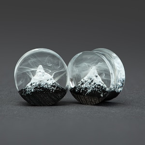 Mountain plugs, wood plugs, resin plugs, ear plugs, custom plugs, handmade plugs, ear gauges and plugs