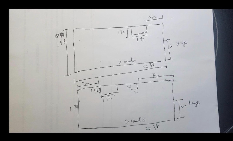 May include: Hand-drawn diagram of two rectangular shapes with dimensions labeled in inches. The top rectangle is 22 7/8 inches long and 11 1/4 inches high, with a 3-inch section and a 1 1/2-inch section. The bottom rectangle is similar.