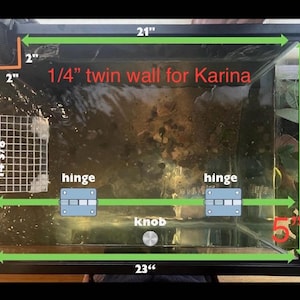 May include: A rectangular black framed aquarium with dimensions marked in inches. The text "1/4 twin wall for Karina" is visible. The tank has hinges, a knob, and a mesh structure inside. Measurements are 21" x 16 3/8" x 23" and 5".
