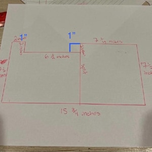 May include: A hand-drawn diagram on white paper with red lines and measurements in inches. The diagram includes dimensions such as 1 inch, 6 1/2 inches, 7 1/4 inches, 7 1/2 inches, 15 3/4 inches, and 2 1/2 inches.