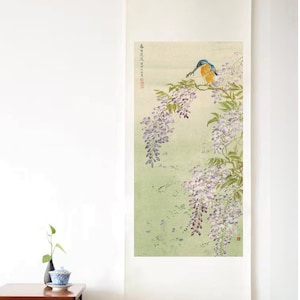 May include: A traditional Japanese scroll painting depicting a blue and yellow bird perched on a branch of purple wisteria flowers. The background is a soft green with scattered purple petals.