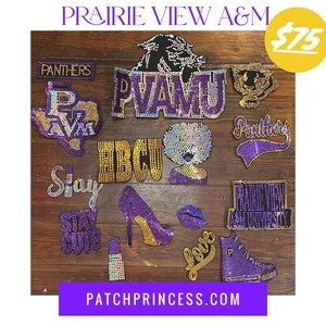 May include: An assortment of rhinestone-studded patches and appliqués in purple, gold, and black. Designs include the words "PVAMU", "Panthers", "Stay Cute", a high heel, lips, a lipstick, and a sneaker. The website address "PATCHPRINCESS.COM" is also visible.