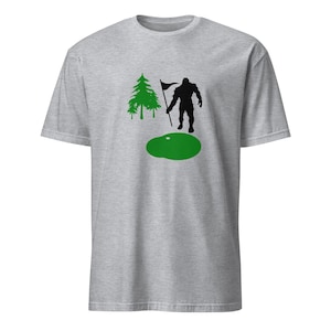 Golfing Bigfoot Short-Sleeve Unisex T-Shirt - Funny Sasquatch Tee, Great Gift for Golf Lovers & Nature Fans, Unique Design
