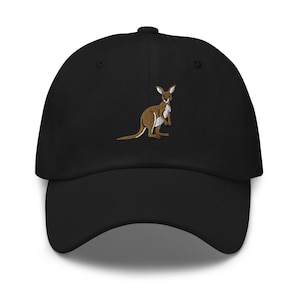 May include: Black baseball cap with a brown and white embroidered kangaroo design. The kangaroo is standing upright with its arms at its sides. The cap has a curved brim and an adjustable strap.