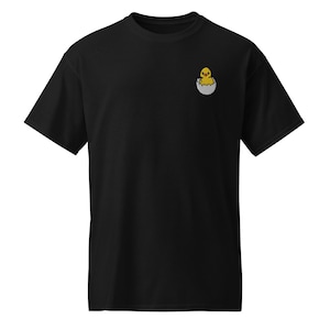 May include: Black t-shirt with a small embroidered image of a yellow chick hatching from an egg.
