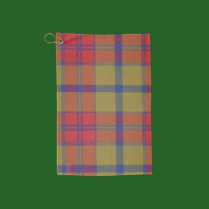 May include: A rectangular golf towel with a plaid pattern in shades of red, orange, yellow, and blue. The towel has a metal grommet and a ring for hanging. The background is a solid green.