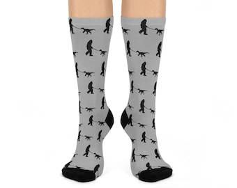 Bigfoot walking a Dinosaur Pup Cushioned Crew Socks