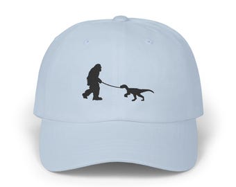 Bigfoot's Dino Stroll Classic Dad Cap, Sasquatch Walking Dinosaur Embroidered Hat, Wildlife Lover Gift, Outdoors Adventures Cap
