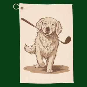 May include: Golf towel featuring a sepia-toned illustration of a Golden Retriever holding a golf club in its mouth. The dog is standing on a patch of grass, with a white background and a loop for hanging.