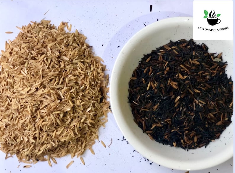 May include: Two piles of rice husks, one pile is light brown and the other is dark brown and black. The dark brown and black pile is in a white bowl. The text "Ceylon Spices Foods" is visible in the top right corner of the image.