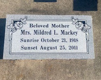 May include: A gray granite headstone with black lettering. The inscription reads "Beloved Mother Mrs. Mildred L. Mackey Sunrise October 21, 1918 Sunset August 25, 2011".