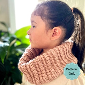 May include: A pink crocheted cowl neck warmer. The pattern is available for purchase. "Pattern Only" is written on a teal blue circle.