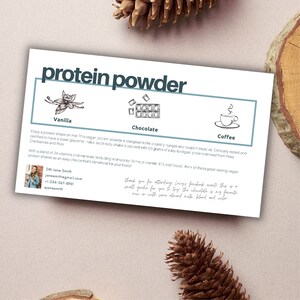 May include: A white card with the text "protein powder" in black lettering. The card features three illustrations of protein powder flavours: vanilla, chocolate, and coffee. The card also includes contact information for DM Jane Smith.