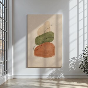 Può includere: Stampa artistica astratta con tre forme organiche impilate in beige, verde oliva e arancione ruggine. Una sottile linea nera curva attraverso le forme. L'opera d'arte è esposta su uno sfondo neutro, creando un'estetica minimalista.