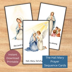 May include: Three rectangular prayer cards featuring watercolor illustrations of Mary. One card shows Mary with an angel, another shows Mary kneeling, and the third shows Mary with children. Text includes "the Lord is", "you among", and "Hail, Mary, full of g".