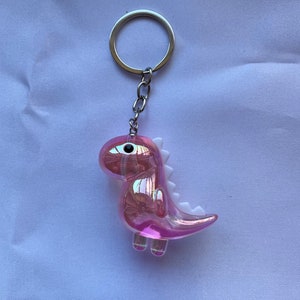 Dinosaur keychain transparentes rosa