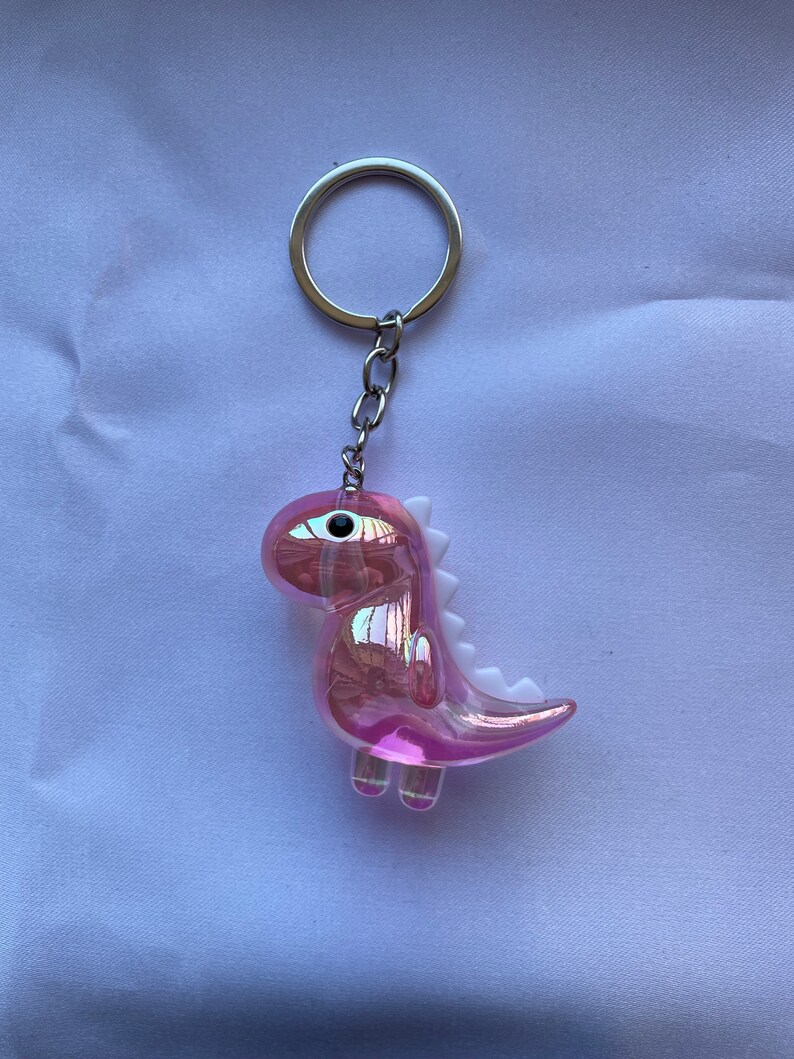 Dinosaur keychain transparentes rosa