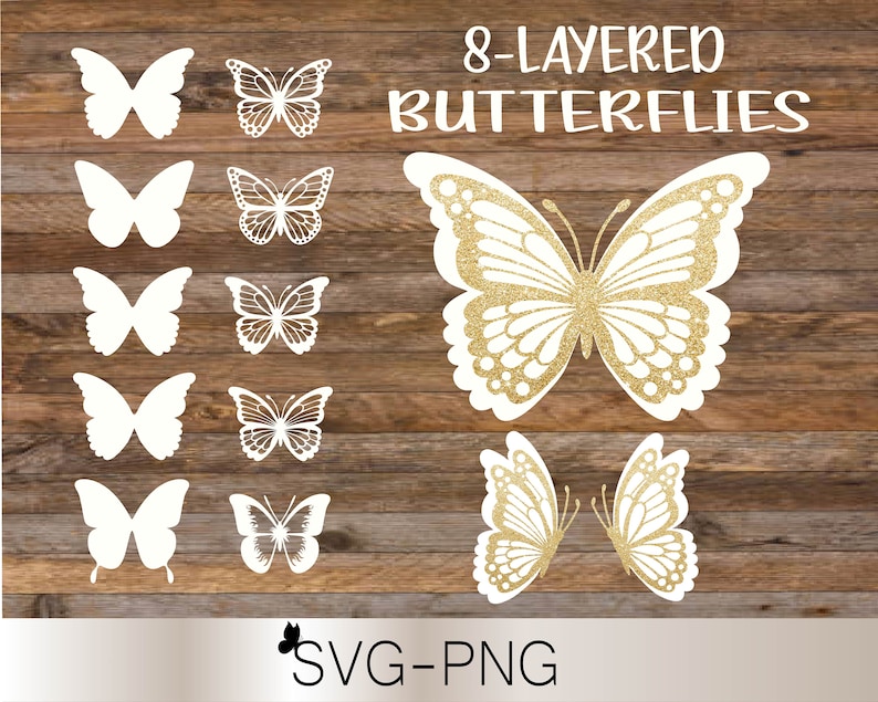 Puede incluir: Ocho recortes de mariposas blancas en capas sobre un fondo de madera. Las mariposas est&aacute;n dispuestas en filas de dos. La fila superior tiene una mariposa de purpurina dorada con el texto "8-LAYERED BUTTERFLIES" encima.
