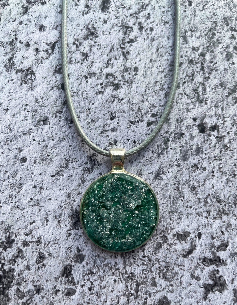 Round Jade Green and Metallic Silver Resin Pendant.