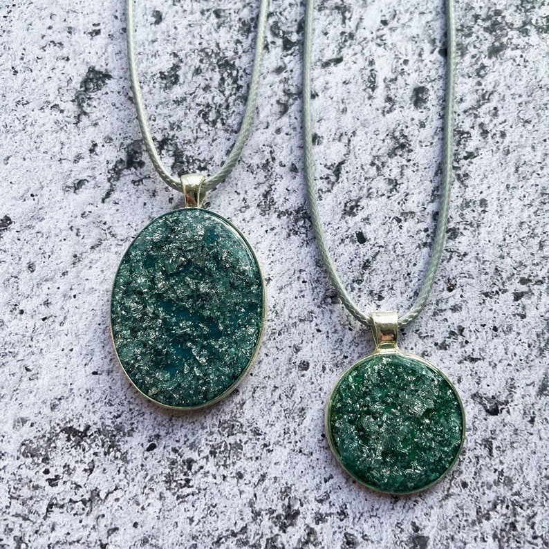 Round Jade Green and Metallic Silver Resin Pendant.