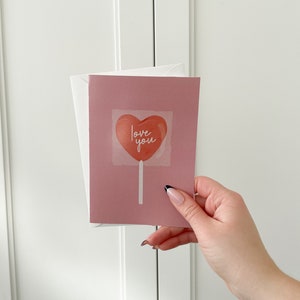 Carte de Saint-Valentin, Illustration rose, Sucette coeur, Carte de voeux, Fête de l'amour, Mot d'amour