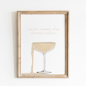 May include: A framed print with a champagne glass and the text "you won't remember all my champagne problems".