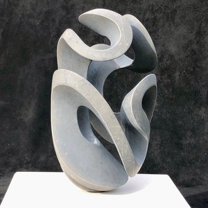 stone sculpture, pebble art, sculpture, contemporary art, decorative object, art piece