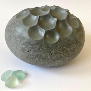 stone sculpture, pebble art, sculpture, contemporary art, decorative object, art piece