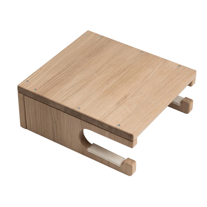 May include: A light-colored wooden desk organizer with a rectangular top and a lower section with a curved cutout. The organizer has two white supports and is made of light-colored wood. The organizer is designed to hold items.