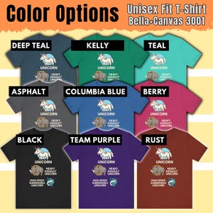 May include: A variety of unisex t-shirts in various colors, including deep teal, kelly green, and black. Each shirt features a unicorn graphic with the text "UNICORN" and "HEAVY ASSAULT UNICORN". The shirts are Bella+Canvas 3001.