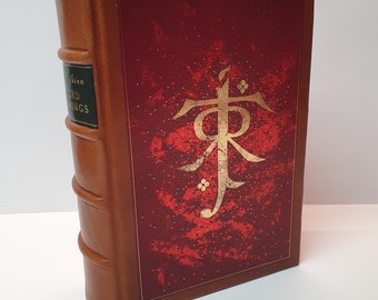 Le Seigneur des Anneaux de J.R.R. Tolkien, reliure cuir ; un volume avec pages d'impression et illustrations d'Alan Lee