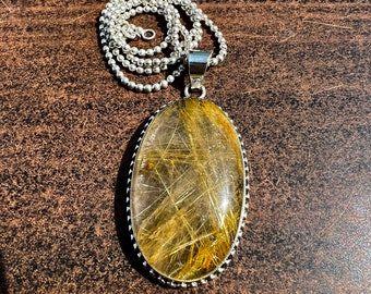 Oval Golden Rutilated Quartz Pendant: Sterling Silver Healing Necklace