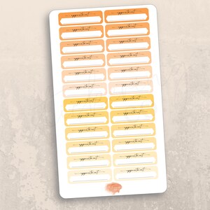 May include: A sheet of 20 orange and yellow appointment stickers with rounded corners and a white background. Each sticker has a blank space for writing in the text "appointment".