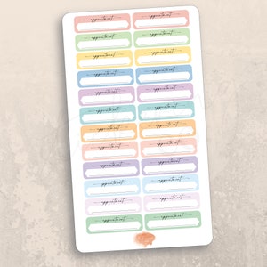 May include: A sheet of pastel colored appointment stickers with rounded corners and a blank space for writing. The stickers are arranged in two columns of 12 stickers each.