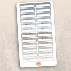 May include: A sheet of 20 gray and blue appointment stickers with rounded corners and a white fill. Each sticker has the word "appointment" written in black cursive.
