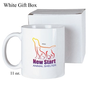 May include: White ceramic mug with a colorful graphic of a dog, cat, and rabbit. The graphic says "New Start Animal Shelter". The mug is 11 oz. and comes in a white gift box.