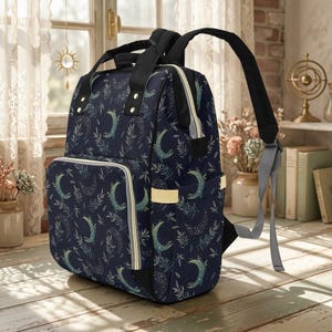 Mochila cambiador con forma de luna creciente, bolsa de viaje para bebé con diseño de luna celestial, organizador para la habitación del bebé para mamás. imagen 2