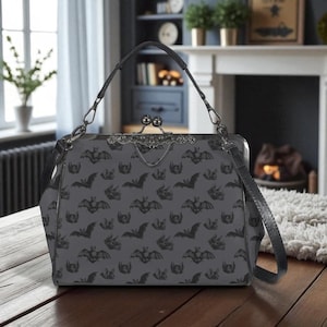 Midnight bat flight handbag, eerie night creature purse, spooky clasp shoulder bag, vintage bat silhouette accessory, dusk print satchel