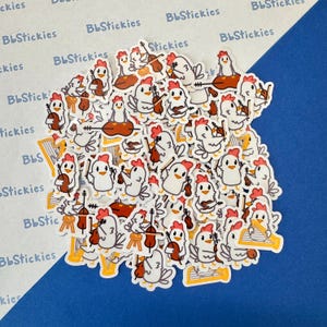 May include: A large collection of white chicken stickers playing musical instruments. The stickers feature a variety of instruments, including a violin, cello, harp, and drums. The stickers are all in a cartoon style and have a whimsical feel.
