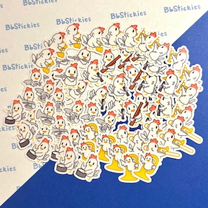 May include: A collection of white chicken stickers playing musical instruments. The stickers feature chickens playing the trumpet, trombone, drums, tuba, and flute. The stickers are on a blue background.