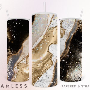 Peut inclure: Trois gobelets en acier inoxydable avec couvercles et pailles. Les gobelets pr&eacute;sentent un motif abstrait noir, dor&eacute; et blanc. Les textes "SEAMLESS" et "TAPERED & STRAIGHT" sont visibles.
