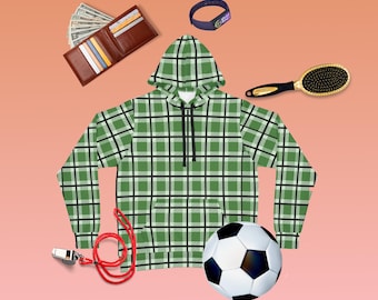 May include: A green and white plaid hoodie with a black drawstring, a soccer ball, a whistle, a red lanyard, a hairbrush, a wallet, and a fitness tracker.