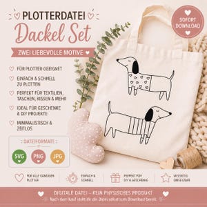 Op de afbeelding: Een crèmekleurige draagtas met twee zwarte teckel illustraties. De tas heeft handvatten en Duitse tekst, waaronder "Dackel Set" en "Sofort Download". Een hartvormig kussen en een spoel touw zijn ook zichtbaar.