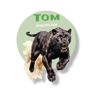 Pode incluir: Um círculo verde com o texto "TOM SCHULKIND 2024" e uma pantera negra saltando para frente com a boca aberta.